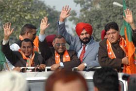 BJP MP Navjot Singh Sidhu (second from right) along with the partys State President Avinash Rai Khanna during a rally in Jalandhar