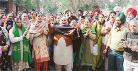 Paramedical and clerical staff of ESI Model Hospital hold a protest against the hospital authorities in Ludhiana on Monday