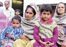 Seven-year-old Pooja and three-year-old Shabnam with Rita in Kirpal Nagar, Gali No. 4, Ludhiana, on Monday