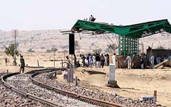 Labourers work at the Zero Point Station at Munabao on Monday.