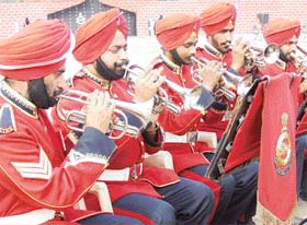 A military band performs at a ceremony to mark the 150th Raising Day of the third battalion of the Sikh Regiment in Bathinda
