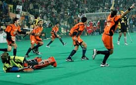 Bangalore Lions celebrate after scoring a goal against Chandigarh Dynamos during the first final of the Premier Hockey League at the Sector 42 Hockey Stadium on Monday
