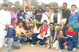 The PSEB XI with the trophy for the first Ramesh Chander Memorial Cricket Tournament played in Ludhiana on Tuesday