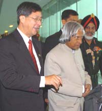 President A.P.J. Abdul Kalam with Lim Boon Heng, senior Minister of Singapore, on his arrival at Changi International Airport in Singapore on Tuesday.