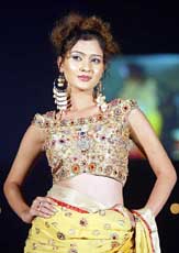 A model displays an outfit at a fashion show in Ahmedabad on Saturday night.