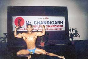 Ajay Kumar shows his muscles during the 12th sub-junior Mr Chandigarh Body Building Championship at DAV College, Sector 10
