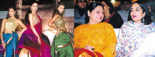 Haryana Chief Minister's wife Asha Hooda and Haryana Tourism Minister Kiran Choudhry (R) witnessing a fashion show presented by renowned fashion designer Ms Shaina at the Hotel Rajhans during the 20th Surajkund Crafts Mela