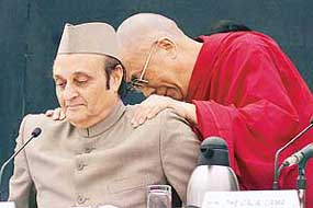 The Dalai Lama and ICCR Chairman and Rajya Sabha MP Karan Singh at the inauguration of an international conference on "Science and spirituality in modern India" in New Delhi on Sunday.