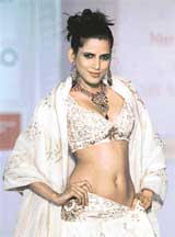 A model displays a creation by fashion designer Anita Dongre at a show in Mumbai on Sunday night. The show was organised by Mercedes Benz to showcase various attributes of Mercedes through a stylised innovative apparel design.