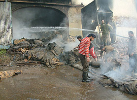 Fire brigade personnel try to extinguish the fire that broke out in a railway godown in Amritsar on Monday.