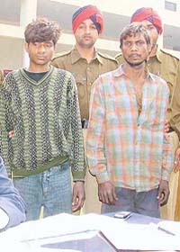 The two accused, Laxman and Akhilesh, in police custody