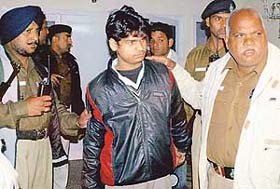 Ajay a servant being taken into police custody for interrogation