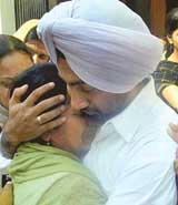 The son and wife of Randhir Singh, who was murdered in Dubai, break down as his body is brought to his residence, Phase 7, Mohali, on Friday