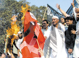 Activists of the Muslim Democratic Forum protesting against the publication of cartoons of Prophet Mohammed in newspapers