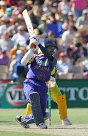 Sri Lankas Kumar Sangakkara hits a boundary during the first final against Australia in Adelaide on Friday. 