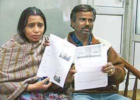 Ms Sumitra Devi and her husband show the documents of the piece of land they had bought, but failed to get possession