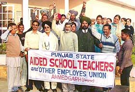 Activists of private aided school teachers and other employees union (Punjab) Ahmedgarh, raising slogans before leaving for a state-level meeting at Patiala