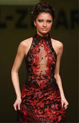 A model displays creation from Nidal and Zihar couture for the Spring and Summer, 2006, collection in Beirut