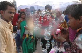 Festivities and water bubbles in the air at a fair organised on the eve of the birth anniversary of Guru Ravi Dass in Jalandhar
