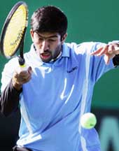 Indias Rohan Bopanna returns the ball to South Koreas Lee Hyung-taik during the Davis Cup Asia-Oceania Group I in Changwon, South Korea, on Sunday. Bopanna lost 3-6, 1-6, 2-6.