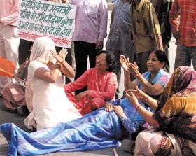 BJP women activists sitting on dharna against the demolition drive at Dabri in the Capital