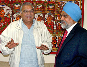 Haryana Chief Minister Bhupinder Singh Hooda with Dr Montek Singh Ahluwalia, Deputy Chairman, Planning Commission, at the Planning Commission office in New Delhi on Monday.