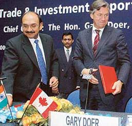 Mr Ajay S. Shriram and Mr Gary Doer sign an MoU for trade between the CII and the Province of Manitoba, Canada, at Chandigarh on Monday.
