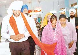 Dildar ties the nuptial knot with Chennai girl Sammanna at the Sector 38 gurdwara in Chandigarh on Tuesday.