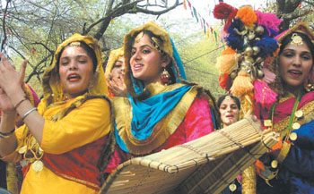Punjabi folk dancers performing a giddha dance during the closing ceremony of 20th Surajkund Craft Mela.