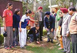 A sapling plantation drive being carried by SSP Narinderpal Singh at the Government College for Women in Ludhiana on Wednesday.