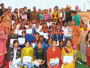 Mr Harnam Dass Johar and staff members with the prize-winners of Shaheed-e-Azam Sukhdev Thapar Government Girls Senior Secondary School at the annual prize distribution function held on Wednesday. I.V.