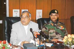 The Haryana Chief Minister, Mr Bhupinder Singh Hooda, and the General Officer Commanding-in-Chief, Western Command, Lt-Gen Daljeet Singh, address media- persons after the Civil Military Liaison Conference at Chandimandir on Friday. 