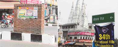 Posters cover the foundation stone which mentions the name of the road as Basant Singh Khalsa Road; and the newly put up signboard indicating the road as Club Road