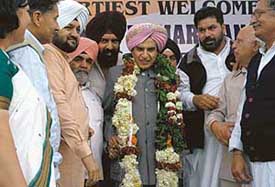 The Minister of State for Finance, Mr Pawan Bansal, is all smiles after being felicitated at a nagrik abhinandan in Sector 22 in Chandigarh on Sunday