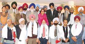 Awardees pose for a group photograph at a function organised by the Punjabi Sahit Akademi in Ludhiana on Sunday