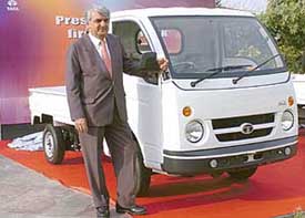 The Vice-President, Sales and Marketing, Tata Motors, Mr Shyam Mani, poses with a newly launched Tata Ace mini truck in New Delhi on Monday. 