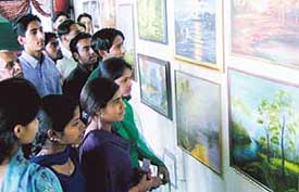 Children at a painting exhibition at Government College, Sector 46, Chandigarh, on Monday.