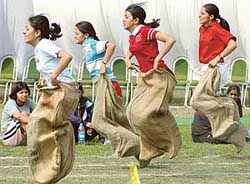 Students participate in sack race at the annual sports meet in Government College for Girls, Sector 11, Chandigarh, on Monday. 