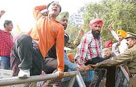 The Punjab ETT Unempolyed Teachers Union hold a protest at Matka Chowk, Chandigarh, on Monday. 