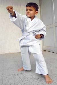 'Karate kid' Rudraksh Gupta, strikes a determined pose for lensmen in Chandigarh on Monday. 