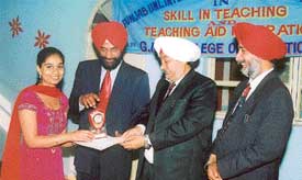 Gurinder Pawar receives the second prize in teaching of English from the chief guest at a function at GMT College of Education in Ludhiana
