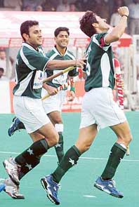 Pakistan captain Muhammad Saqlain (right) celebrates on scoring a goal against India during the third match of the series at the Olympian Surjit Hockey Stadium in Jalandhar on Monday. 
