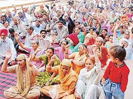 Workers of the Communist Party of India hold a rally near the DCs office in Chandigarh on Wednesday. 