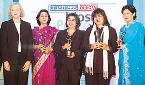 Meg Whitman, President and CEO, eBay, poses for a photograph after giving the Business Today awards for the most powerful women in Indian business to Naina Lal Kidwai, Deputy CEO, HSBC; Punita Lal, Executive Director, Pepsico India; Kiran Mazumdar-Shaw, CMD, Biocon; and Kalpana Morparia, Deputy MD, ICICI Bank, in Mumbai on Wednesday night. 