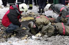 Russian Emergency Situations Minister Sergei Shoigu directs a rescue operation at the ruins of a collapsed market in Moscow on Thursday
