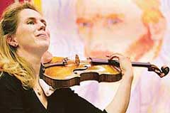 German-born violinist Jeanne-Christee plays a violin known as the Hammer made by renowned violin-maker Antonio Stradivari in 1707 at Christies auction house in London on Friday. The violin is expected to fetch between $1.5m and $2.5m when it is offered for auction in New York on May 16.