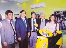 Anil Malhotra of Stan Wheels, Hero Honda MD Suman Kant Munjal, Naresh Malhotra and Hero Cycle Chairman O.P. Munjal with Kanika Soni at the launch of Just for Her, the first all-women outlet in the region. 