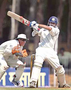 Gautam Gambhir of Board Presidents XI plays a shot as England wicketkeeper Geraint Jones looks on during the second day of the three-day warm-up match in Vadodara on Friday.