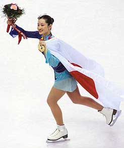 Shizuka Arakawa of Japan celebrates after winning the womens figure skating event at the Winter Olympics in Turin, Italy, on Thursday.