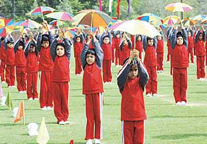 Young students of Strawberry Fields World School, Sector 26, present a colourful umbrella dance at the annual sports day in the school campus in Chandigarh on Saturday.